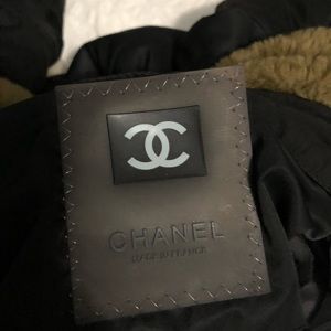 Black Chanel puffer Jacket has a small rip inside
